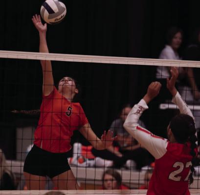 Cambridge’s Jalen Kent slams a kill against Hoxie.