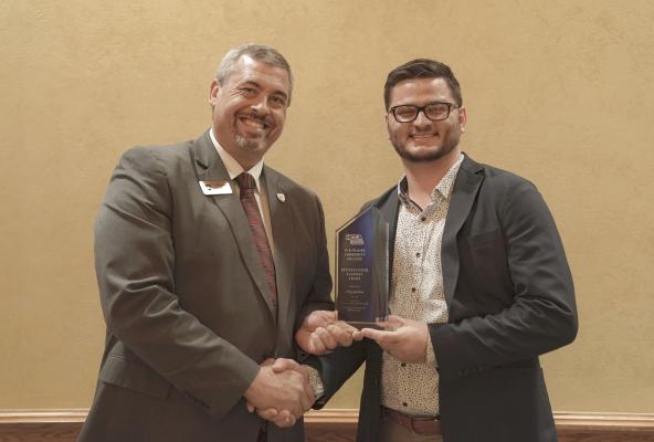 Clay Jordan (right) receives the 2024 Distinguished Alumni Award from Mid-Plains Community College President Ryan Purdy during the Nov. 3 Nebraska Community College Association’s annual meeting in Norfolk, Neb.
