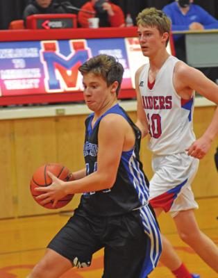 Arapahoe’s Ander Wasenius weaves through traffic in the lane.