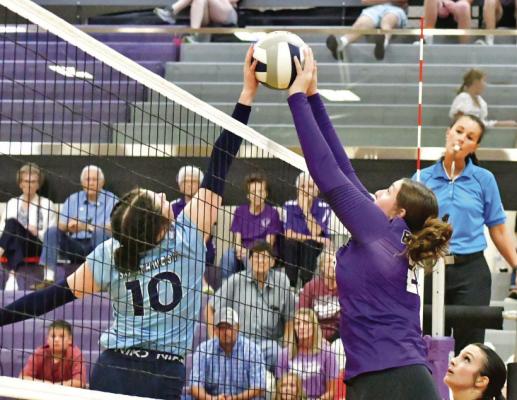Southwest’s Aspen Billeter and Southern Valley’s Tori Bose joust at the net.