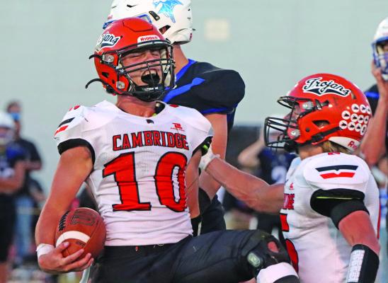 Cambridge’s Maverick Webb celebrates a fumble recovery. He came up with four turnovers along Friday, including a pick-six.