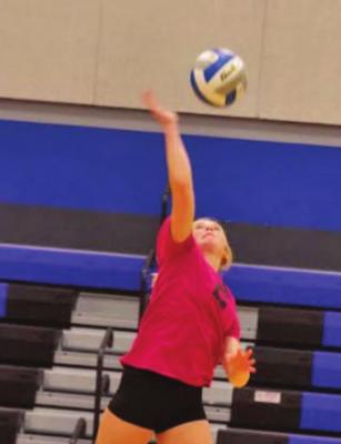 Arapahoe’s Emerson Swanson attacks a ball against Northern Valley.