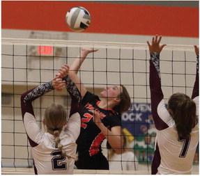 Cambridge’s Brooklyn Holtze attacks a ball against Dundy County-Stratton last Tuesday.