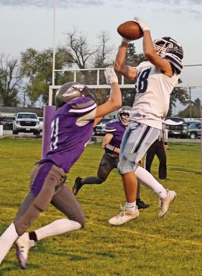 Southwest’s Trenton Williams rises for a reception near the goal line in Friday’s playoff game at Garden County.
