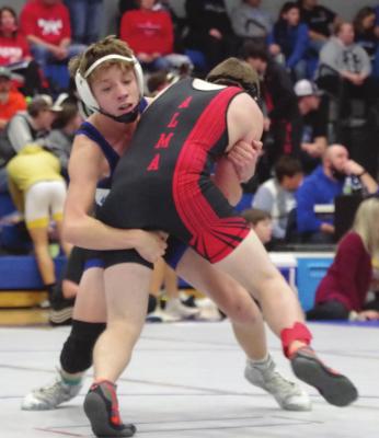 Arapahoe’s Taylor Jones works for control in a match Saturday.