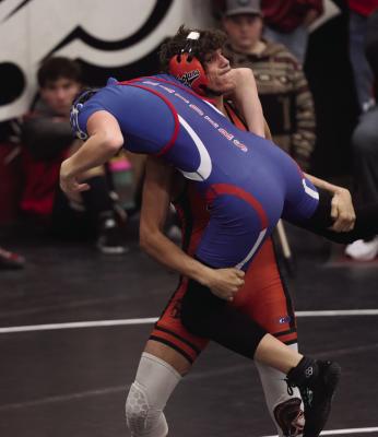 Cambridge’s Dierks Sayer finishes a double-leg takedown.
