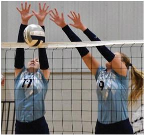 Southwest’s Bryn Lampe and Annika Nelms block an attack.
