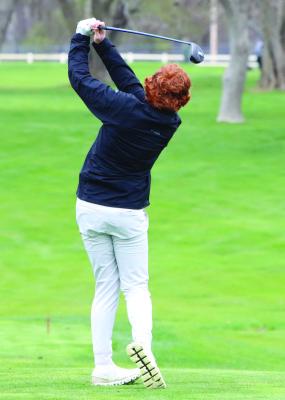 Cambridge’s Micah Gerlach fires a tee shot on the ninth at Cross Creek Friday.