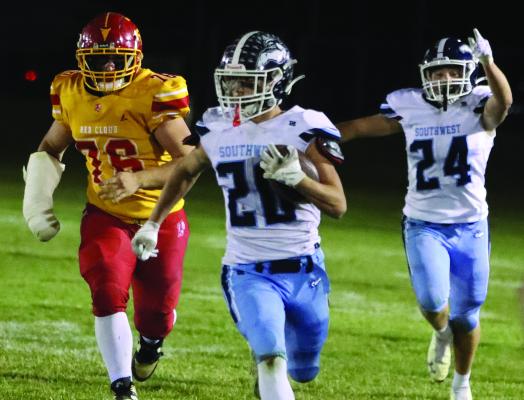 Southwest’s Jacob Barber breaks free on a run while Conner Weaver anticipates the result.