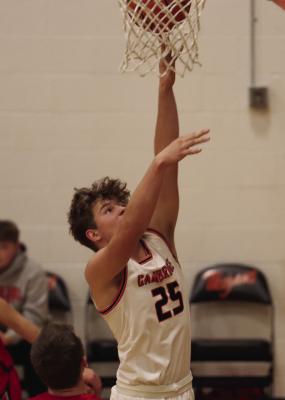 Cambridge’s Braydon Miller puts up a layup.
