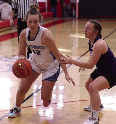 Southwest’s Bailey Truksa drives past a Hitchcock County defender.