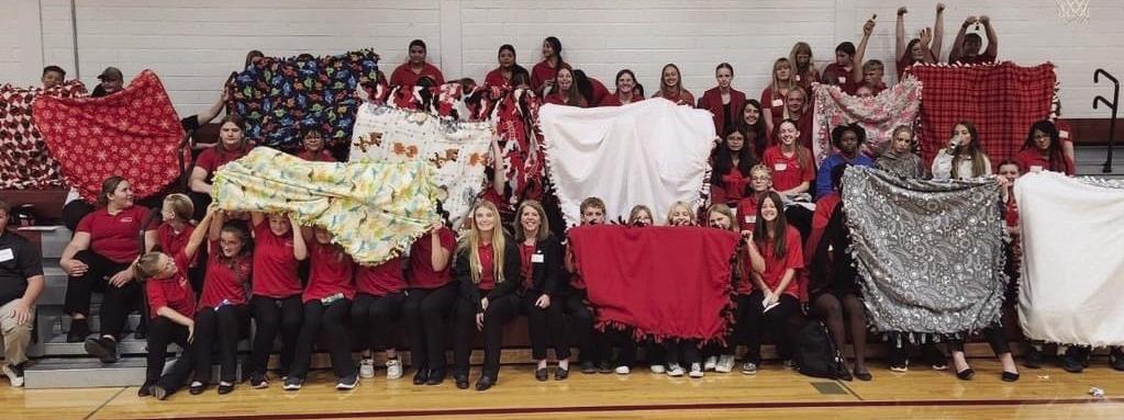 The Elwood FCCLA hosted a leadership conference at their school last week. Seven schools attended. They worked on a project making blankets for donation.