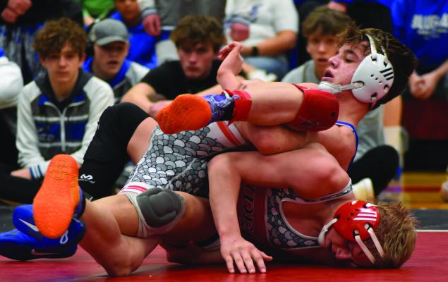 Arapahoe’s Briggs Hill captured a 10-8 victory in the 132 championship match Saturday.