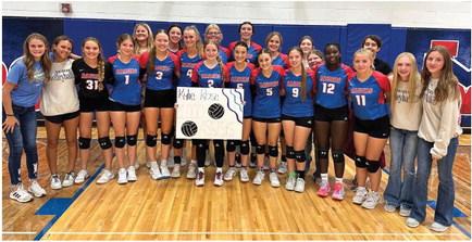 The Medicine Valley volleyball team helped Kylie Rose celebrate 1,000 carrer assists for the Raiders.
