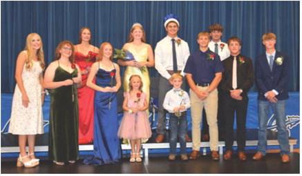 Arapahoe 2026 Homecoming Royalty: Back row (l-r) Desi Farner, Queen Clara Hilker, King Trey Downey, Hudson Sich. Front row (l-r) 2025 Queen Emma Strand, Adelyn Hoefs, Princess Ruby McCune, Crownbearers Reesly Spaulding and Sterling Helms, Prince Aiden Roush, Briggs Hill and the 2025 King Conner Shifflet. (Corrected copy)
