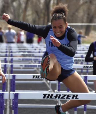 LEFT: Southwest’s Mitchell Stritt leaves the blocks. ABOVE: The Roughriders’ Anastasia Gallegos is all smiles as she swept both titles in hurdles events.