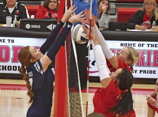 Southwest’s Bryn Lampe wins a joust at the net.