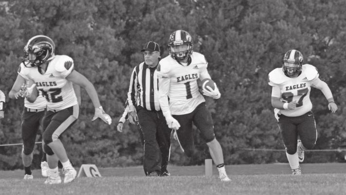 Southern Valley’s Brody Yant returns a kick at Bertrand with Dakota Coppedge and Isaak McPhillamy.