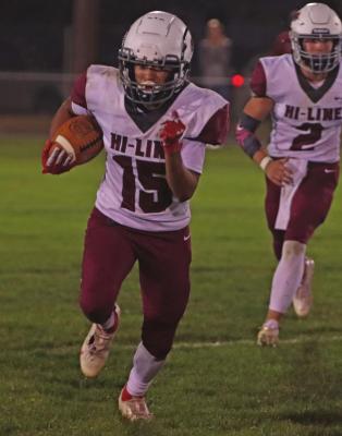 Hi-Line’s Isaiah Bullis takes off on a long run around the right end.