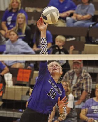 Arapahoe’s Emma Strand attacks from the pin.