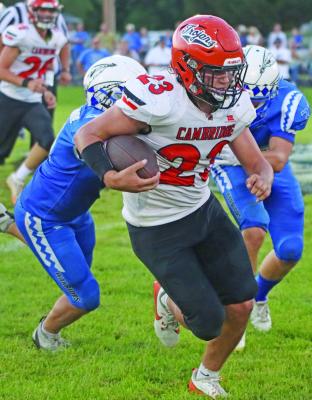 Cambridge’s Braydon Miller breaks a tackle on his way to a 59-yard touchdown run. (308)