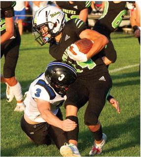 MHC’s Grady Erickson is bottled up on a run.