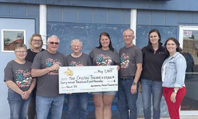 Those attending the check presentation to the Arapahoe Theater were (from left to right): Connie Hoefs, Alexis Barnes, George Probasco, Don Sandell, Tiffany Downey, Terry Polston, Laura McInturf, Shasta Hambidge