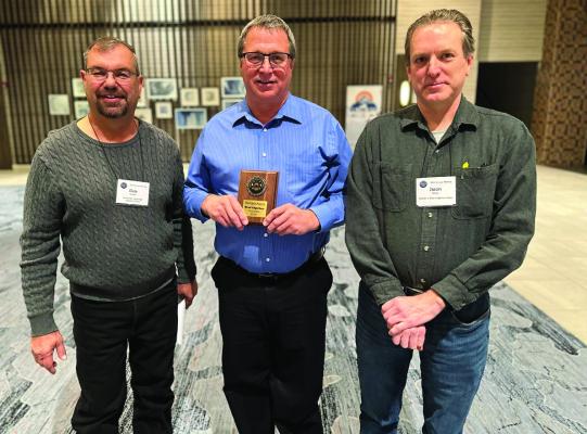 Brad Edgerton (middle) was honored with the Nebraska Headgate Award at the 2025 Four States Irrigation Council’s annual meeting, with the award being presented by Dale Cramer (left) and Jason Orton (right).