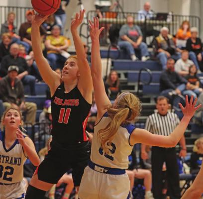 Cambridge’s Autumn Deterding powers up around a Bertrand defender inside as the Trojans rallied for a late win against the Vikings Saturday.