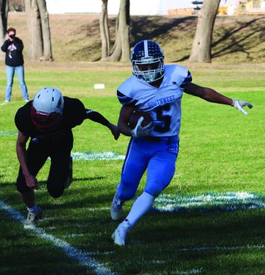 Southwest’s Carter Van Pelt tup-toes the sideline at Parkview Christian Friday.