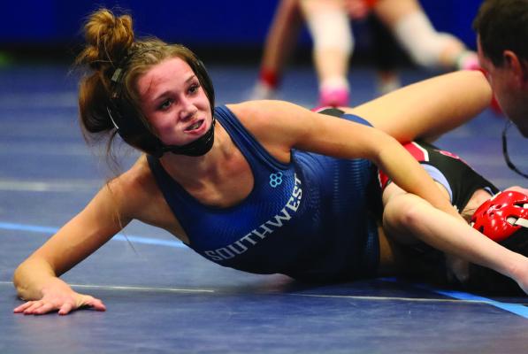 Southwest’s Capri Sayer earns a fall to clinch first place Friday.