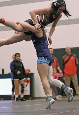 Southwest’s Rylan Custard blasts a double-leg and scores a takedown at the Chase County Invite Saturday.