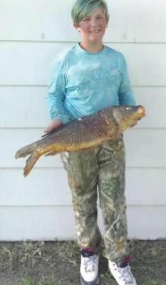 Pictured above: Dakota Bufford with her shoot winning Big Carp.