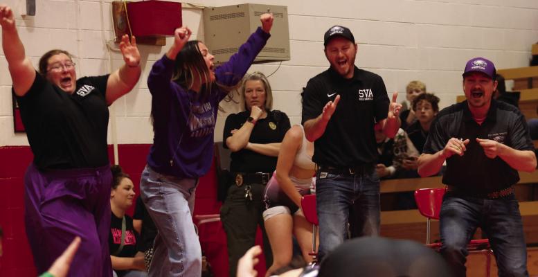 Southern Valley/Arapahoe coaches celebrate Elena Lee’s victory to clinch a berth at State.