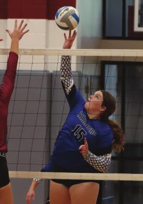 Arapahoe’s Hope Koller tips an attack.