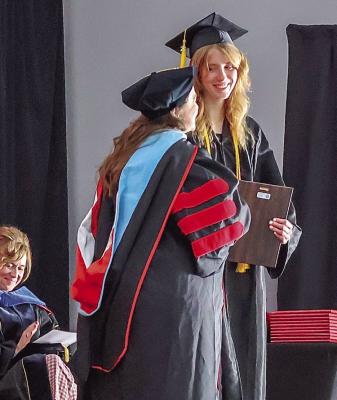 Hannah Brett receives Aggie of the Year award from Dr. Jennifer Mc-Conville, associate Dean of NCTA.