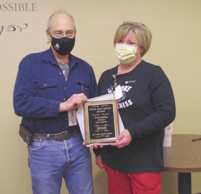 Pictured is licensed award winner Dixie Jauken with Mark Harpst, grandson of the late Merle Harpst.