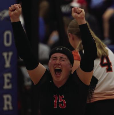 Cambridge’s Bailee Ahlemeyer celebrates a point durin the fifth set of the Trojans’ victory over Overton Tuesday.