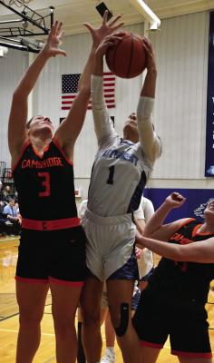 Southwest’s Anastasia Gallegos and Cambridge’s Mallory Springer both jump and reach for a rebound in the paint.
