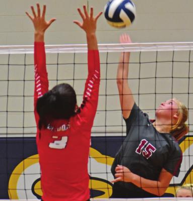 Hi-Line’s Jaci Muegerl (above) and CiCi Lerdall (below) attempt attacks against Pleasanton last Thursday.