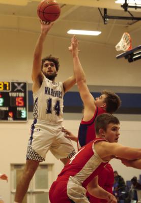 Arapahoe’s Carl Nordine pulls up for a shot against Medicine Valley defender Austin Roblee.