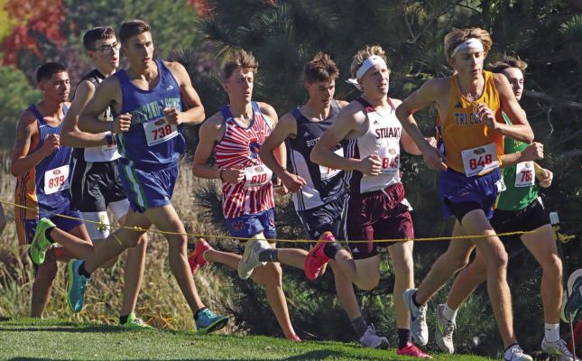 Medicine Valley’s Kael Garrett (above) tries to stay with the top pack at State. Pictured below are Cambridge’s JoLie Farr (bottom left) and Southern Valley’s Tayley Becker (bottom right).