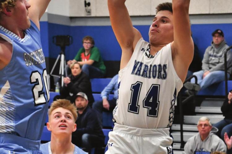 Arapahoe’s Ander Wasenius fires a jumpshot from the wing.