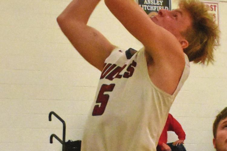 Hi-Line’s Cooper Ray rises in the lane for a layup.
