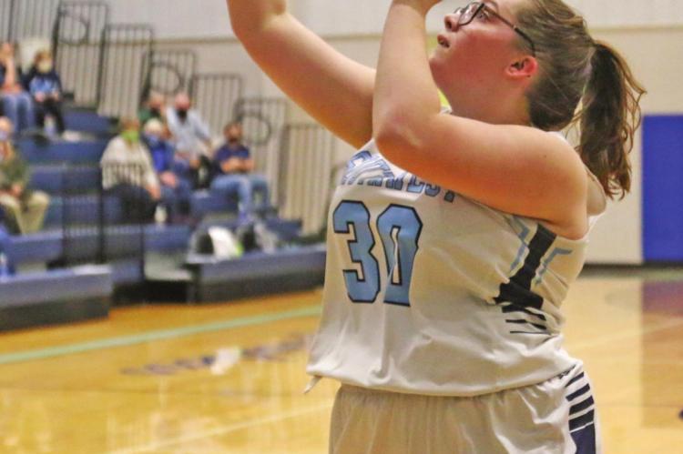 The Roughriders’s Kiana Martin fires a jumper in the lane.