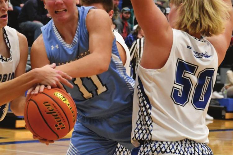 Southwest’s Hunter Blume is fouled on his way through the lane.