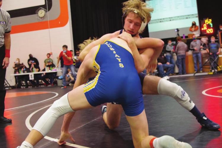 Southwest’s Matt Van Pelt battles a Norton wretsler at the Fran Jorgensen Invite Saturday in Cambridge.