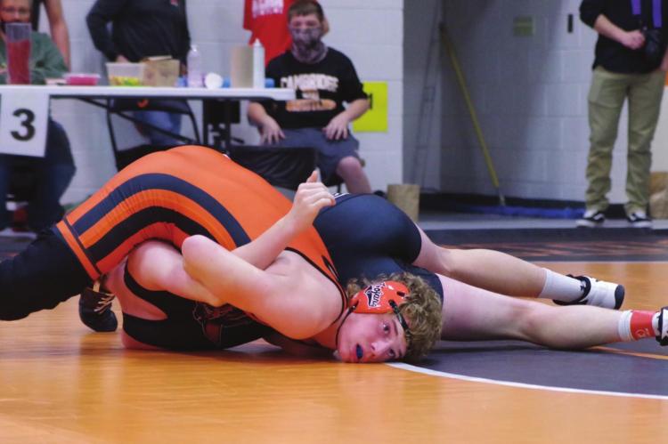 Cambridge’s Ty Stanton nears a pin in a match at the Fran Jorgensen Invite Saturday.