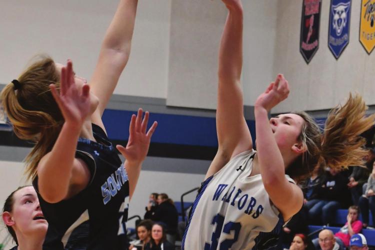 Southwest’s Atleigh Nelms rises to block the shot of Arapahoe’s Rylee Bahe.