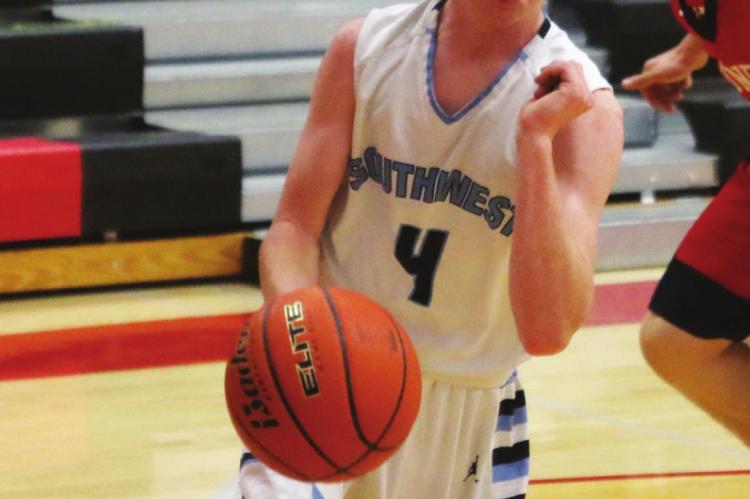 Southwest’s Nate Rippe drives baseline.